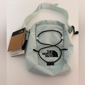 The North Face Powder Blue crossbody with Black Bungee